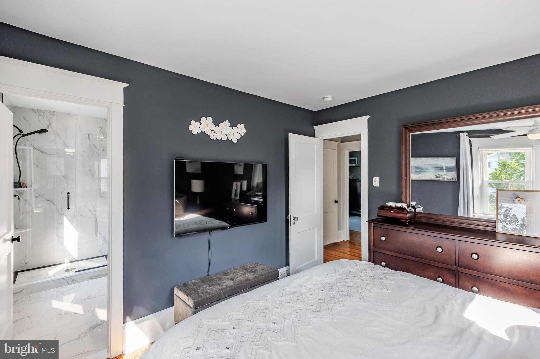536 Kathmere Road Havertown, PA 19083 - Photo 28 of 45 a bedroom with a bed and a dresser with mirror