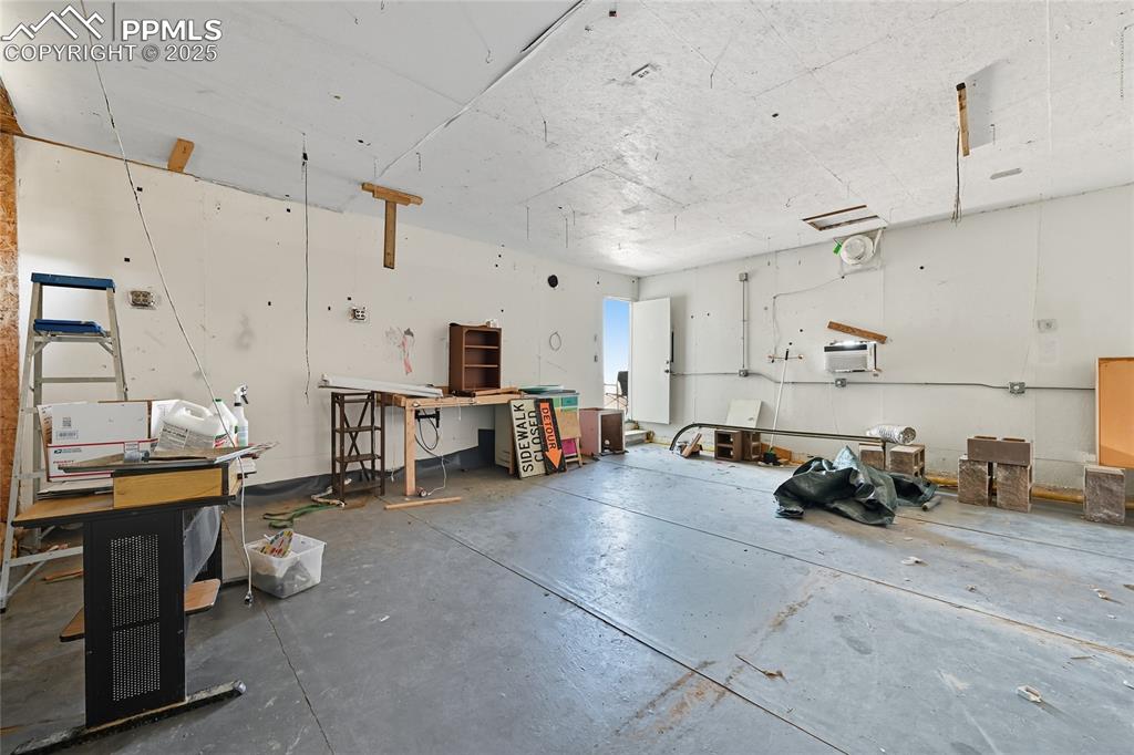 16595 Yoder Road Calhan, CO 80808 - Photo 11 of 28 a room with lots of chairs and musical instruments