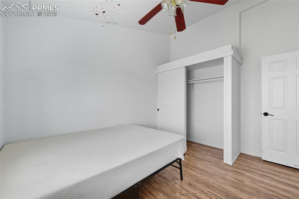 16595 Yoder Road Calhan, CO 80808 - Photo 23 of 28 a view of empty room with wooden floor