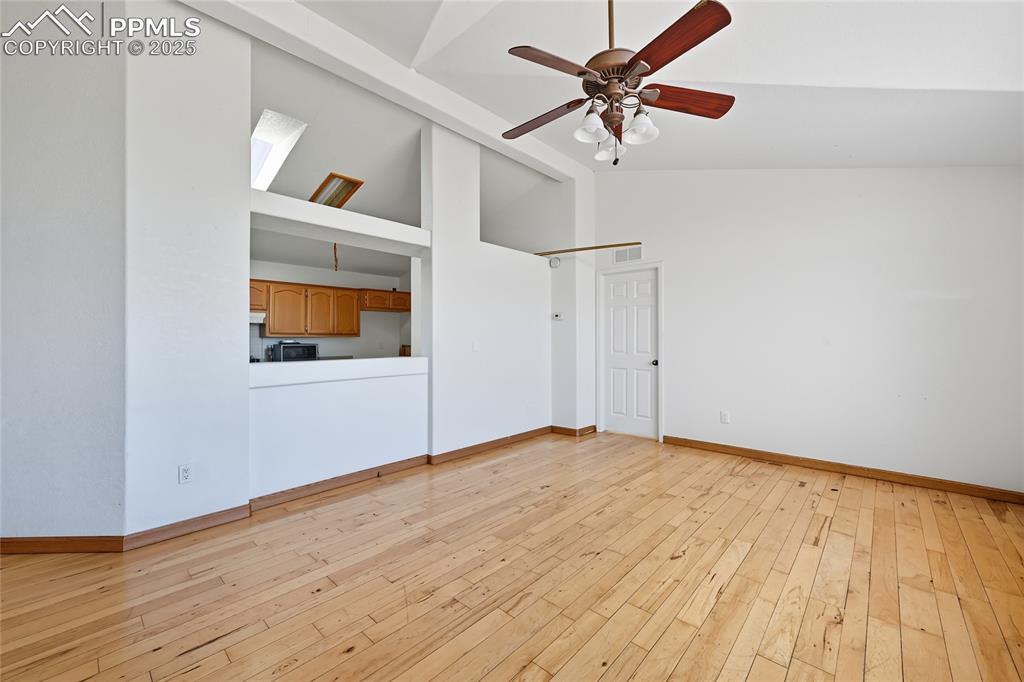 16595 Yoder Road Calhan, CO 80808 - Photo 3 of 28 a view of empty room with wooden floor