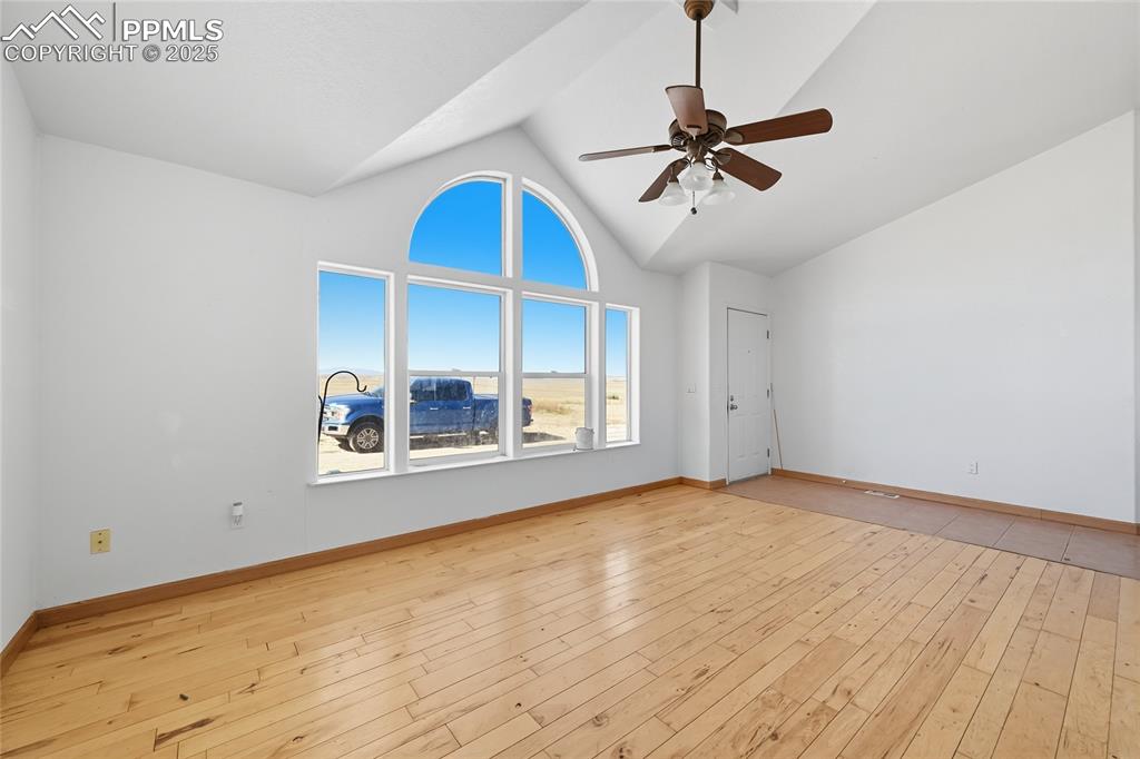 16595 Yoder Road Calhan, CO 80808 - Photo 4 of 28 a view of an empty room with a window