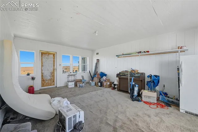 a view of a livingroom with furniture and toys