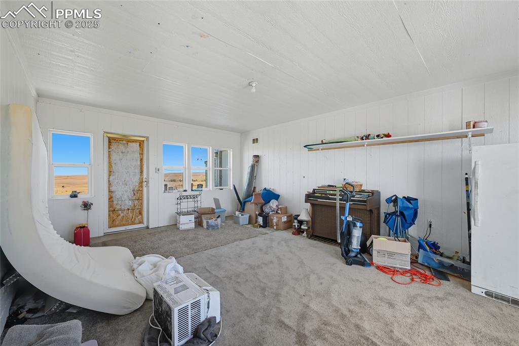 16595 Yoder Road Calhan, CO 80808 - Photo 8 of 28 a view of a livingroom with furniture and toys
