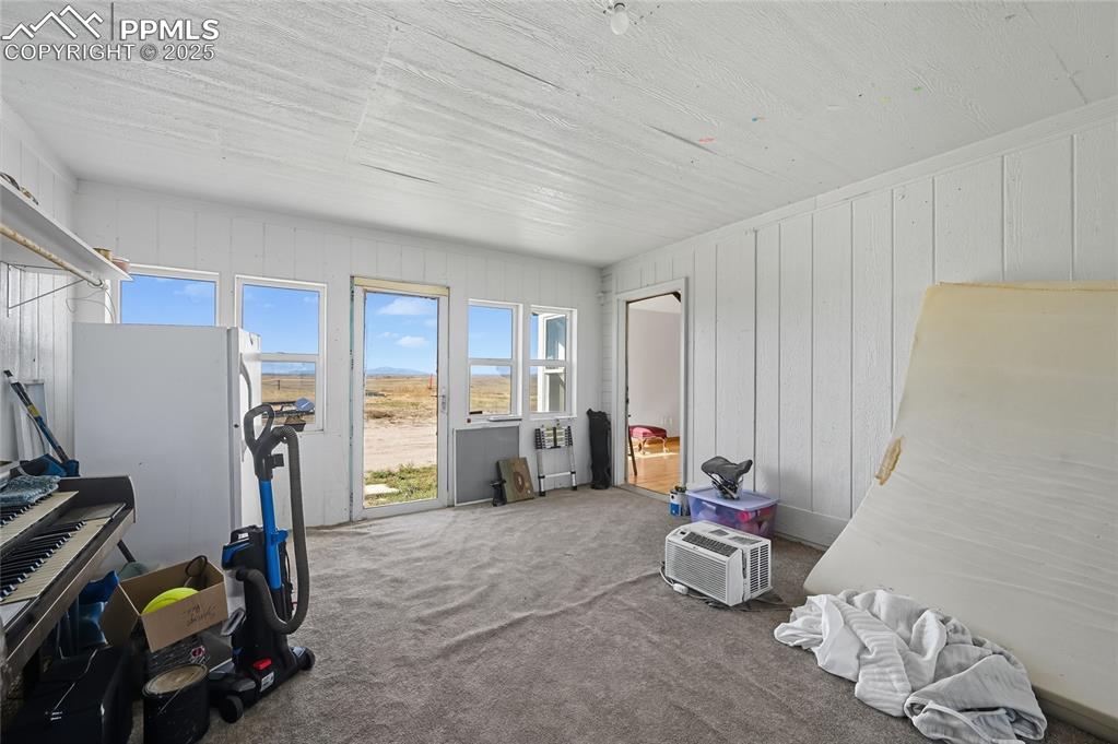 16595 Yoder Road Calhan, CO 80808 - Photo 9 of 28 a room with gym equipment and a window