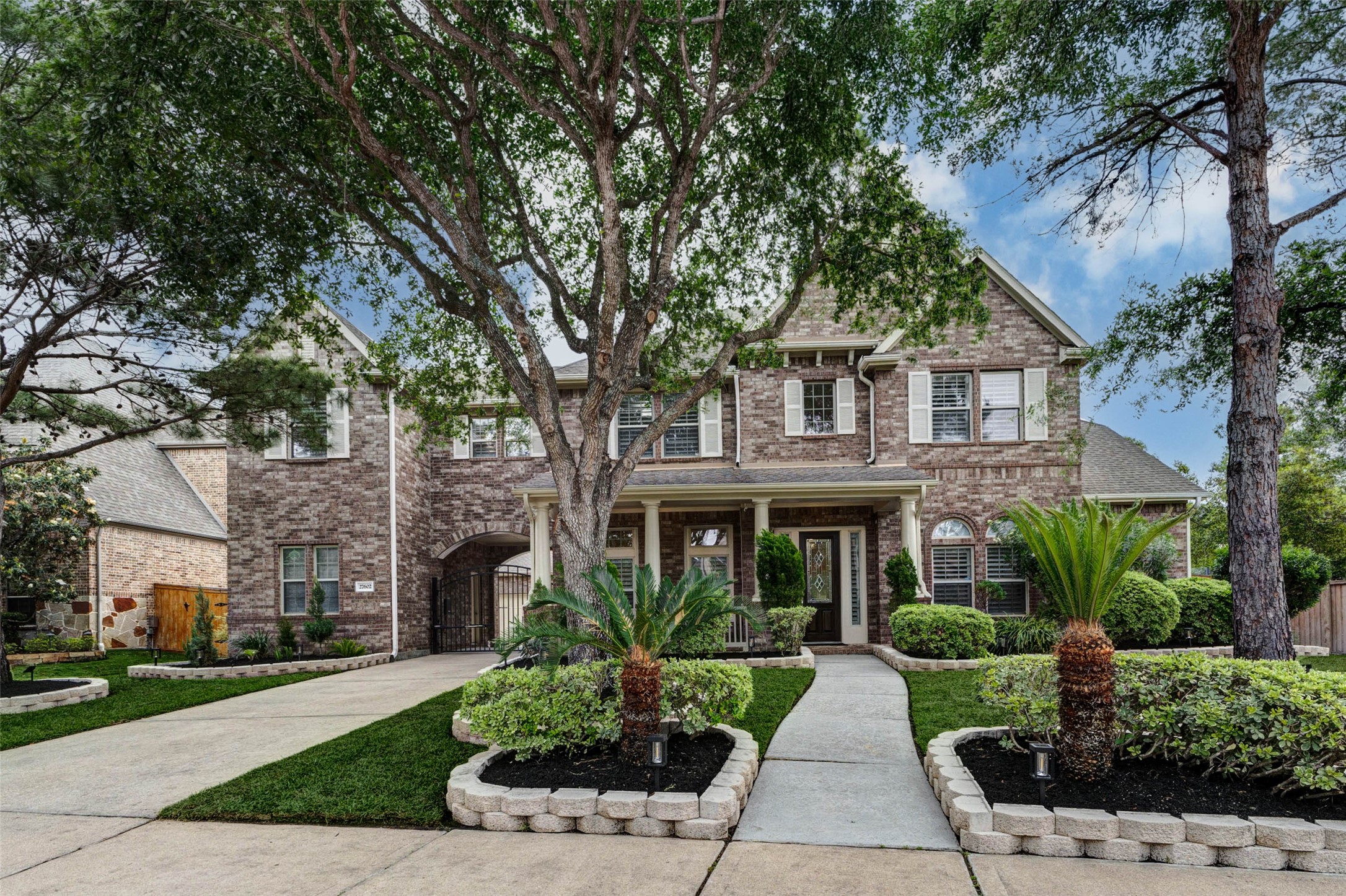 Welcome to 27602 Guthrie Ridge Lane Katy, TX. The elegant entry framed by mature trees and sculpted landscaping, offer a welcoming and refined first impression.