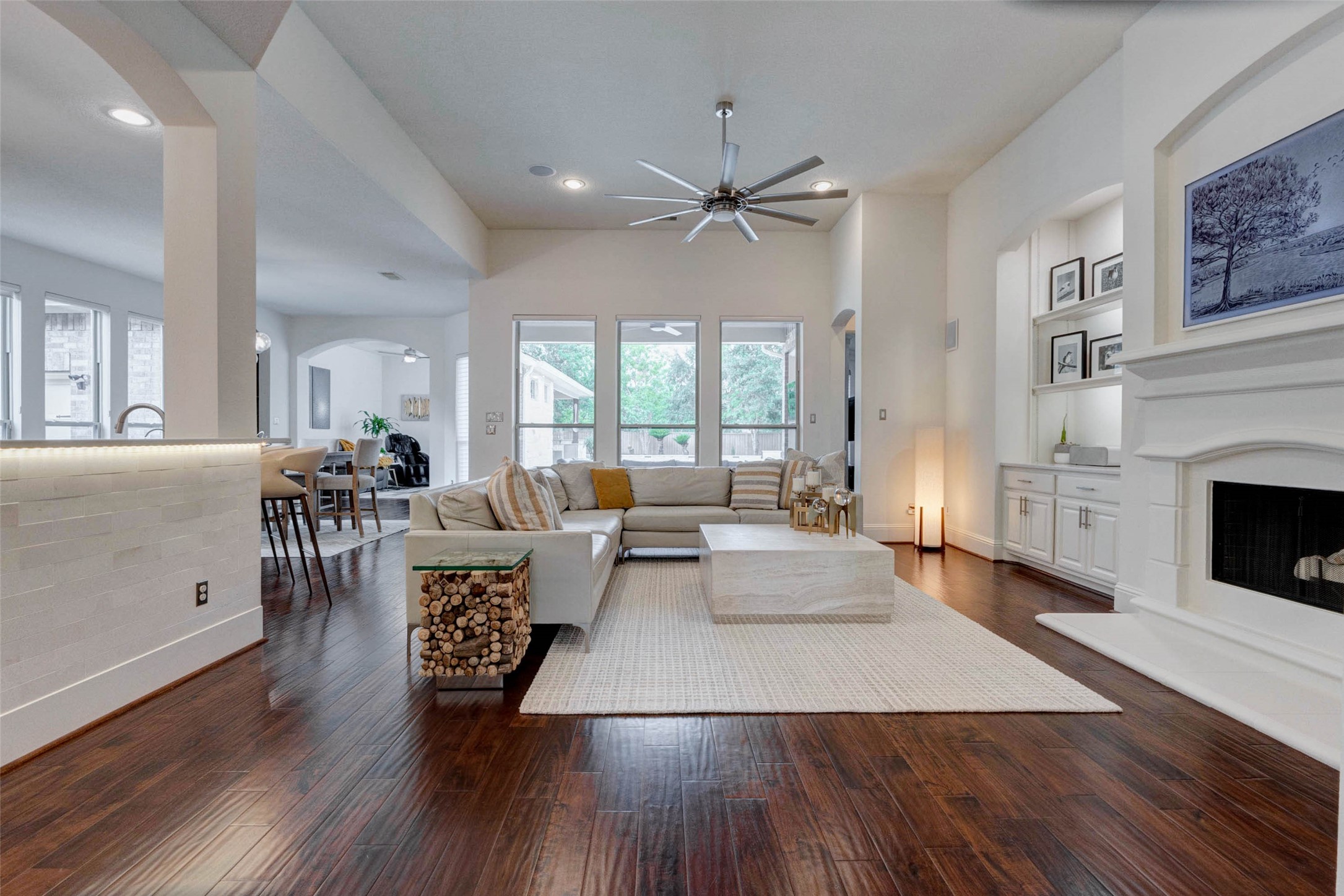 27602 Guthrie Ridge Lane Katy, TX 77494 - Photo 11 of 50 The open-concept living area is bathed in natural light, with high ceilings and large windows that create an airy feel, while flowing effortlessly into the kitchen and dining areas. Windows are fitted with smart Hunter Douglas Nantucket shades with voice control.