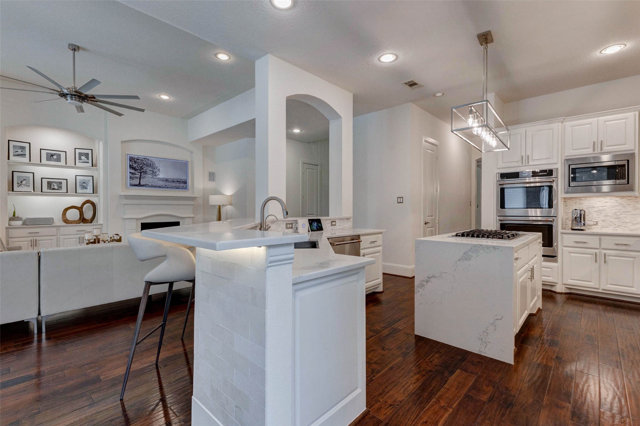 27602 Guthrie Ridge Lane Katy, TX 77494 - Photo 15 of 50 The designer kitchen is a true centerpiece of the home, featuring a large central island, and premium GE Cafe appliances ensuring both style and functionality, complemented by sleek, clean, and modern cabinetry.