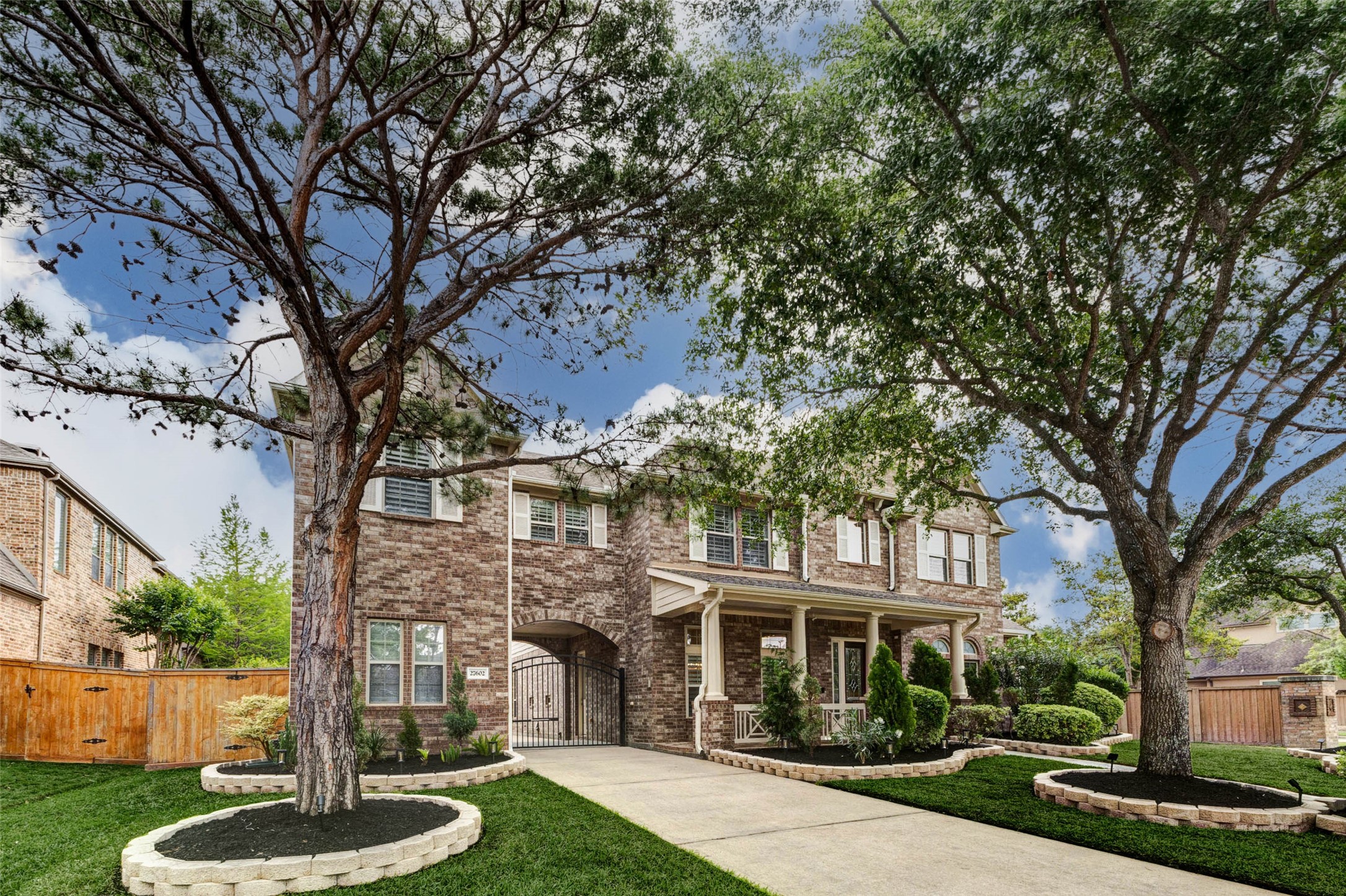 27602 Guthrie Ridge Lane Katy, TX 77494 - Photo 2 of 50 A symmetrical brick exterior and mature landscaping create a classic, timeless look.