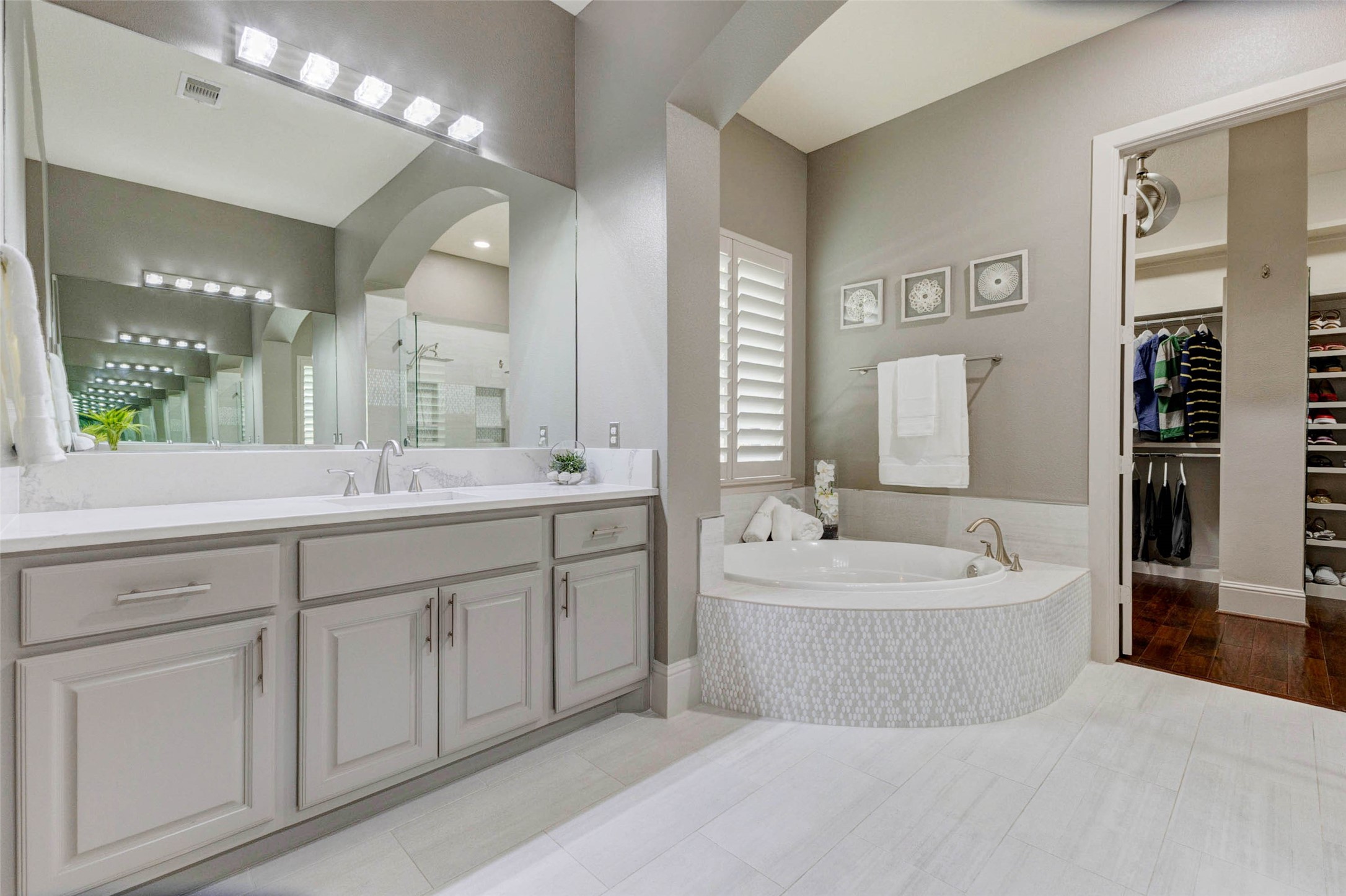 27602 Guthrie Ridge Lane Katy, TX 77494 - Photo 22 of 50 Spa-inspired primary bath with dual vanities, oversized soaking tub, and elegant finishes throughout.