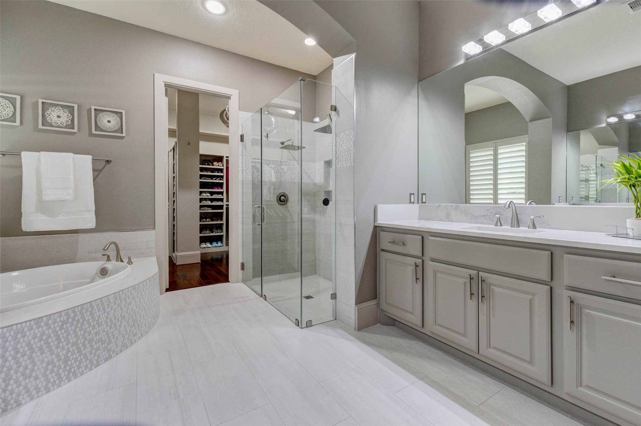 27602 Guthrie Ridge Lane Katy, TX 77494 - Photo 23 of 50 Frameless glass shower complemented by modern tile work and seamless access to the custom closet.