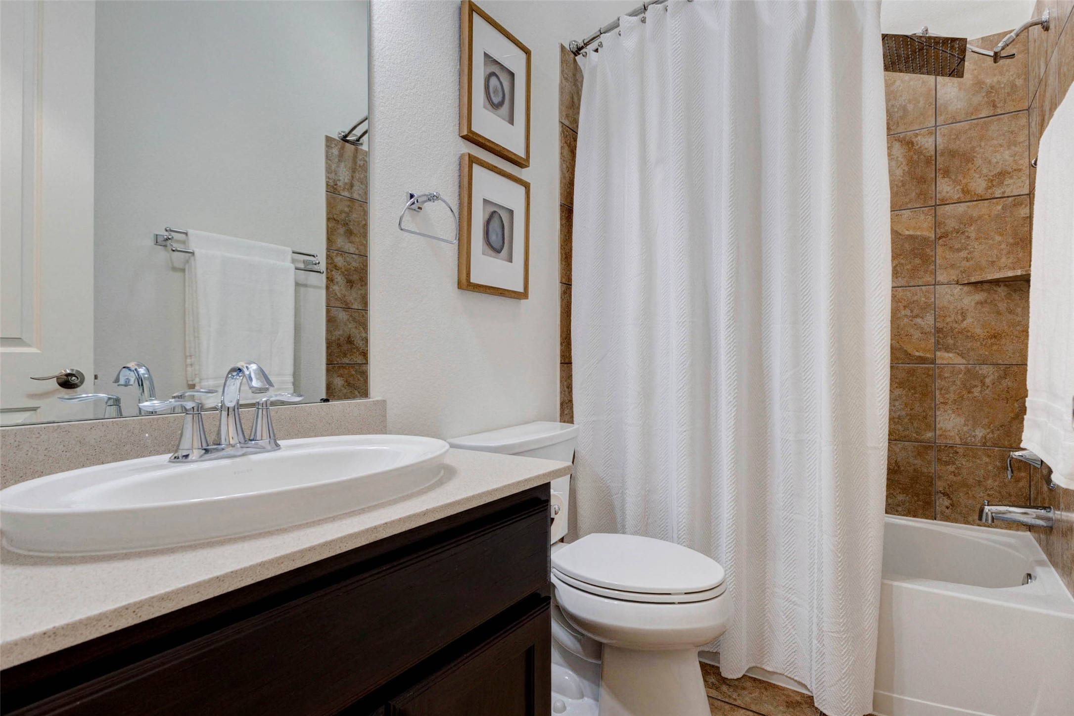 27602 Guthrie Ridge Lane Katy, TX 77494 - Photo 27 of 50 The ensuite secondary bath#1 features a clean, well-designed layout with a tiled shower surround and functional finishes.