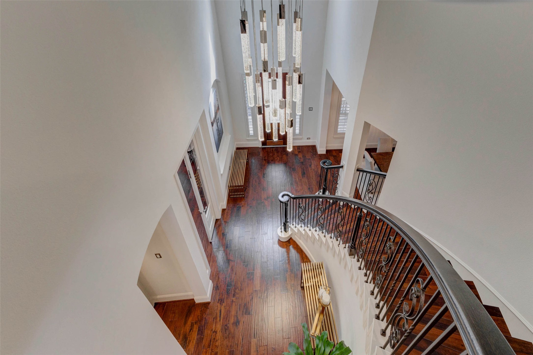 27602 Guthrie Ridge Lane Katy, TX 77494 - Photo 28 of 50 The view from the top of the stairs captures the elegance of the sweeping staircase, soaring ceilings, and a chandelier that enhances the home’s architectural presence.