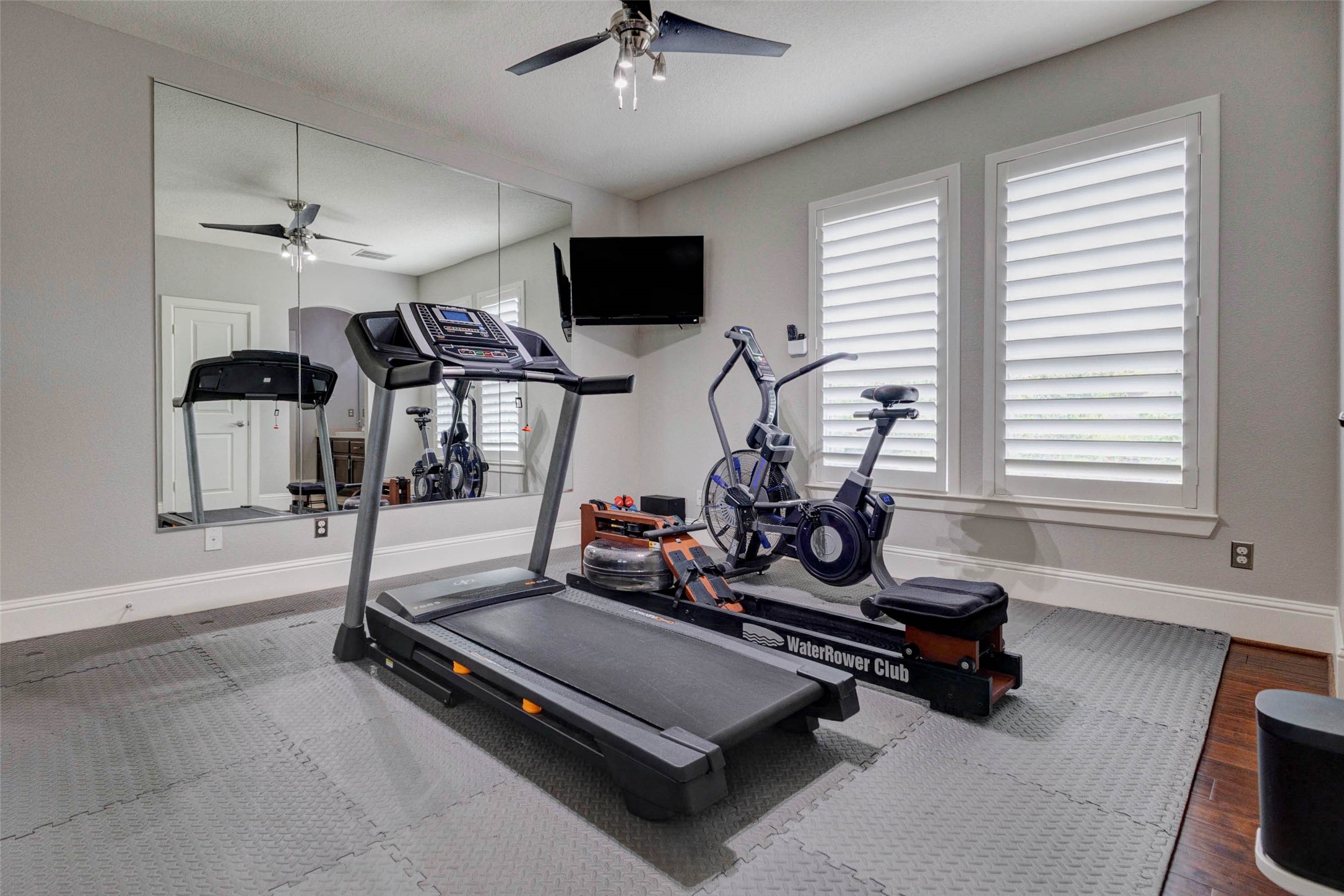 27602 Guthrie Ridge Lane Katy, TX 77494 - Photo 32 of 50 This room has been thoughtfully transformed into a private gym, featuring two mirrored walls and a full equipment setup—all included—creating a ready-to-use fitness space at home.
