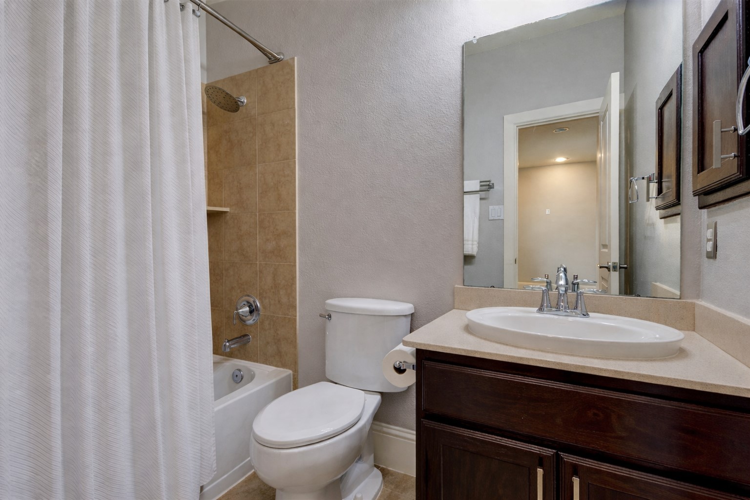 27602 Guthrie Ridge Lane Katy, TX 77494 - Photo 39 of 50 Secondary bathroom #4 features a streamlined design with a tile shower surround and polished fixtures, conveniently located adjacent to bedroom #4.