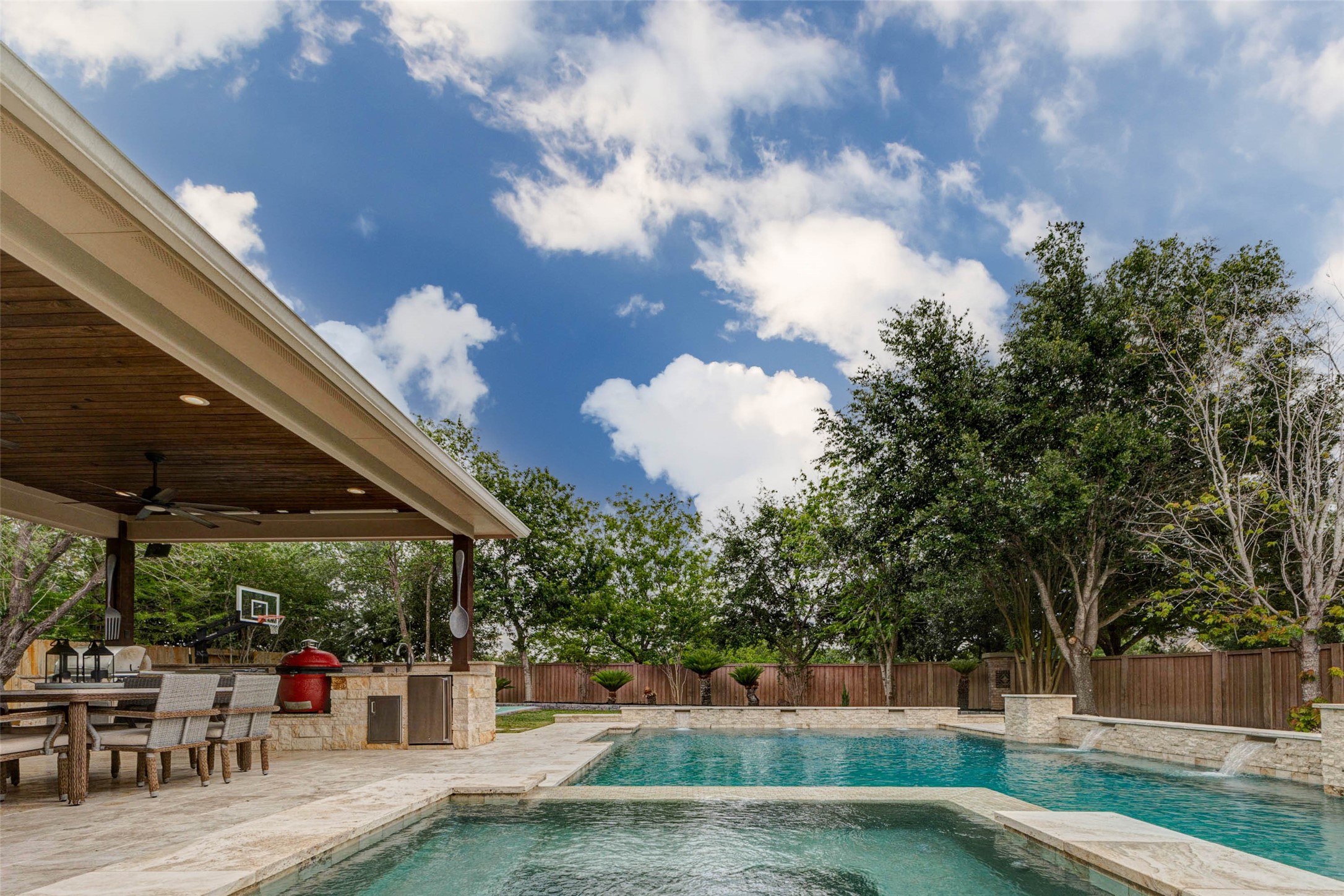 27602 Guthrie Ridge Lane Katy, TX 77494 - Photo 40 of 50 The serene backyard setting combines gentle water features, and a lush, tree-lined backdrop for everyday enjoyment enhanced by exceptional privacy with no back neighbors and no adjacent neighbor on one side.
