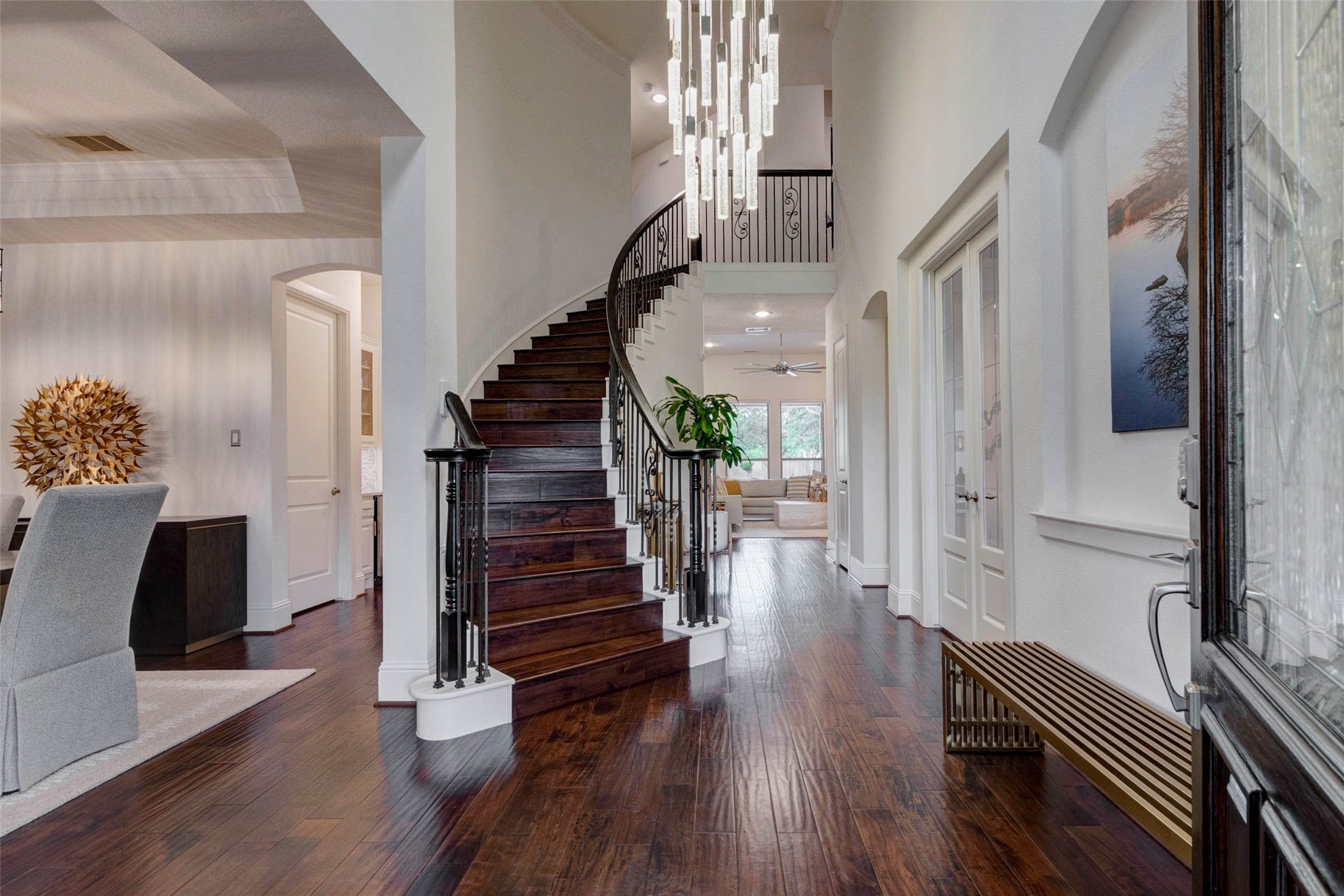 27602 Guthrie Ridge Lane Katy, TX 77494 - Photo 6 of 50 Walk into a dramatic double-height entry with a sweeping staircase and statement chandelier that anchors the space.