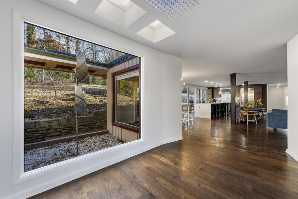 2979 Ridge Valley Road Northwest Atlanta, GA 30327 - Photo 1 of 1 a view of livingroom with furniture wooden floor and window
