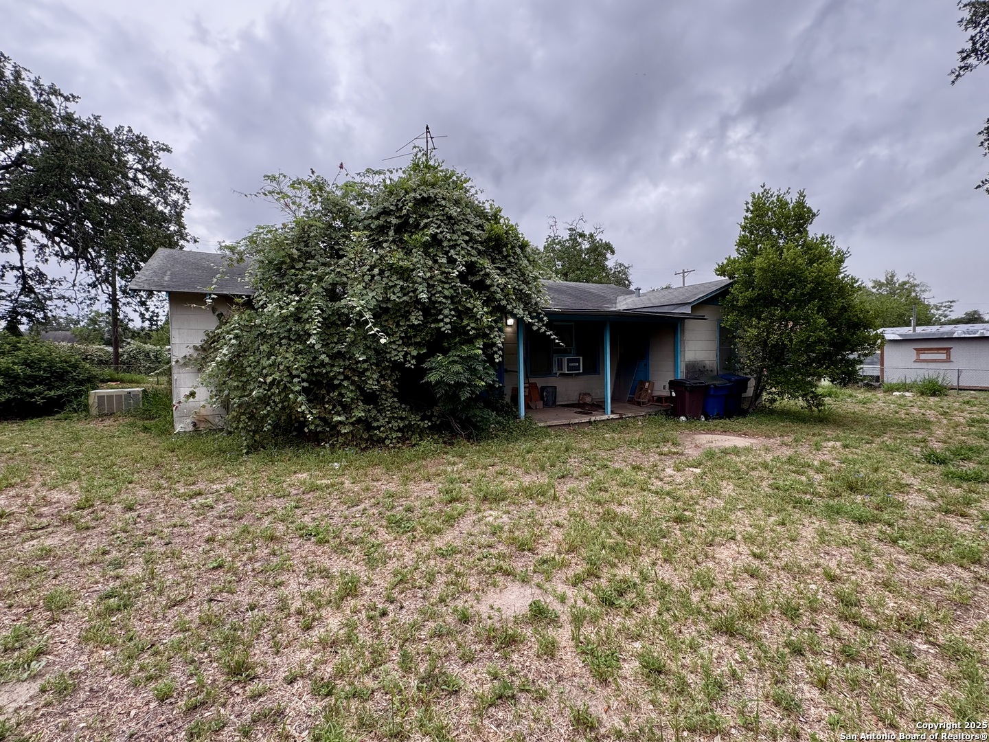 212 Patrick Pleasanton, TX 78064 - Photo 12 of 13 a front view of a house with garden