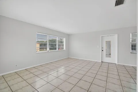 a view of an empty room and window