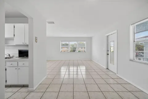 a view of an empty room and window