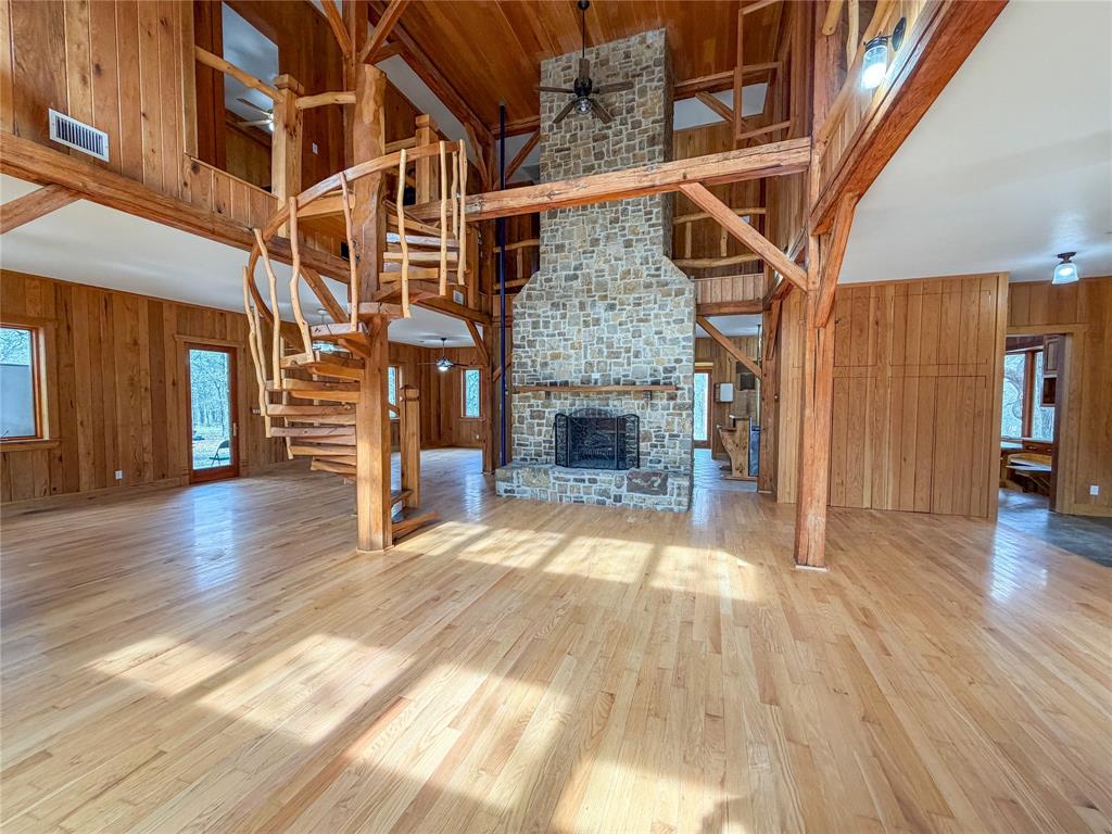 322 Wild Wood Drive Decatur, TX 76234 - Photo 14 of 39 a view of empty room with wooden floor and fireplace