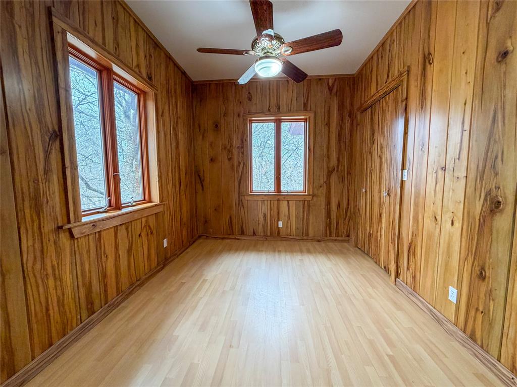 322 Wild Wood Drive Decatur, TX 76234 - Photo 18 of 39 wooden floor in an empty room with a window