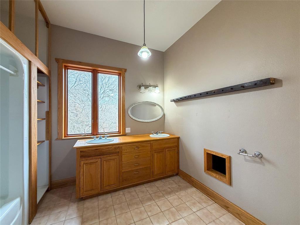 322 Wild Wood Drive Decatur, TX 76234 - Photo 20 of 39 a kitchen with a sink and cabinets