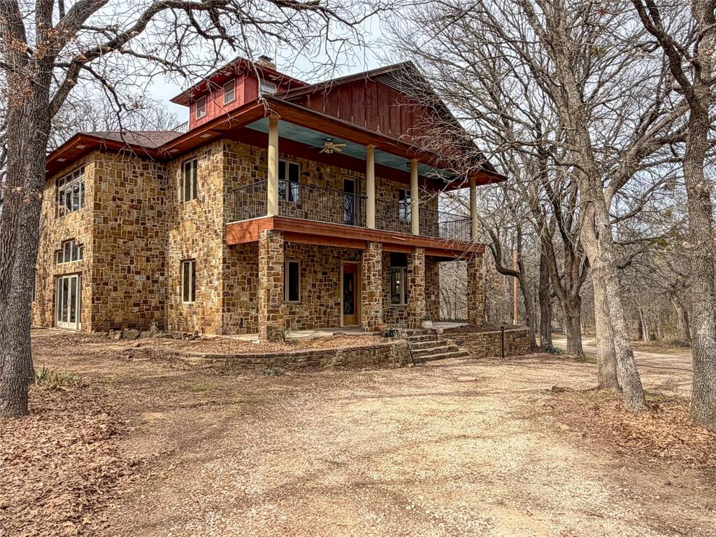 322 Wild Wood Drive Decatur, TX 76234 - Photo 2 of 39 a front view of a house with a yard