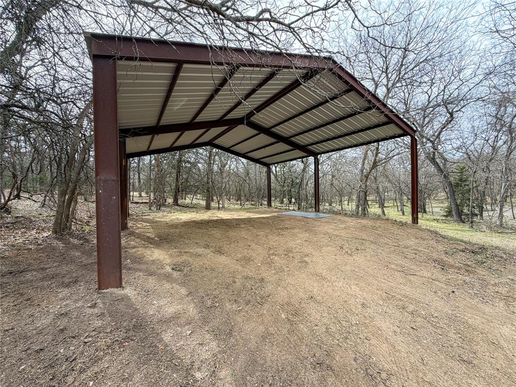322 Wild Wood Drive Decatur, TX 76234 - Photo 31 of 39 a view of large trees with a backyard