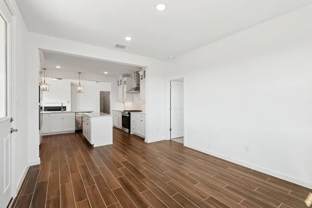 a view of kitchen with wooden floor