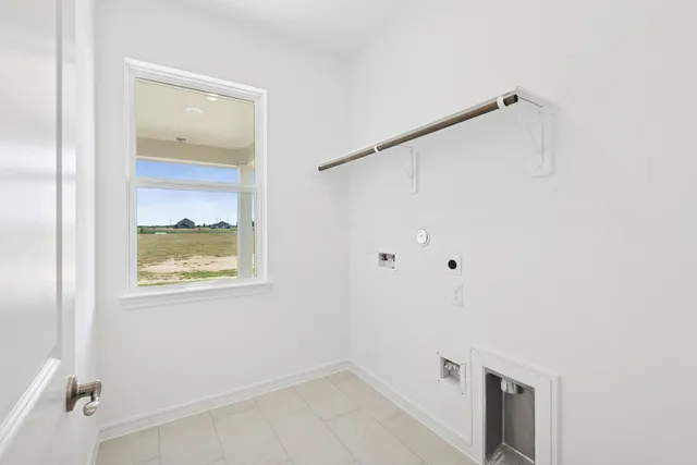 a kitchen with cabinets a sink and chairs