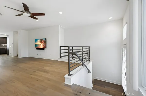a kitchen with stainless steel appliances granite countertop a sink and a refrigerator