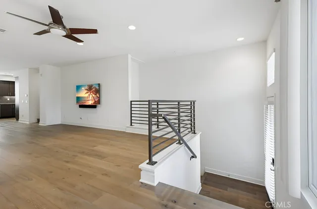 a kitchen with stainless steel appliances a refrigerator sink and cabinets