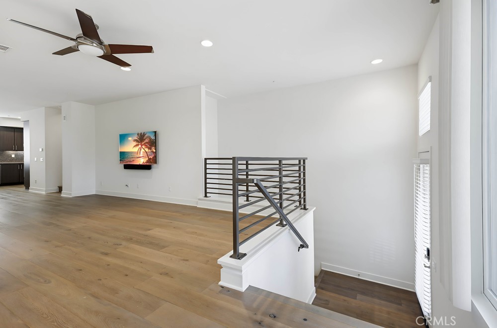 75 Lennox Irvine, CA 92612 - Photo 11 of 73 a view of a livingroom with wooden floor and a ceiling fan
