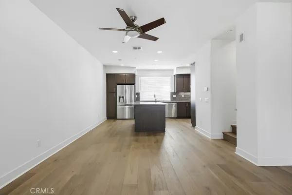 a kitchen with a sink and a refrigerator