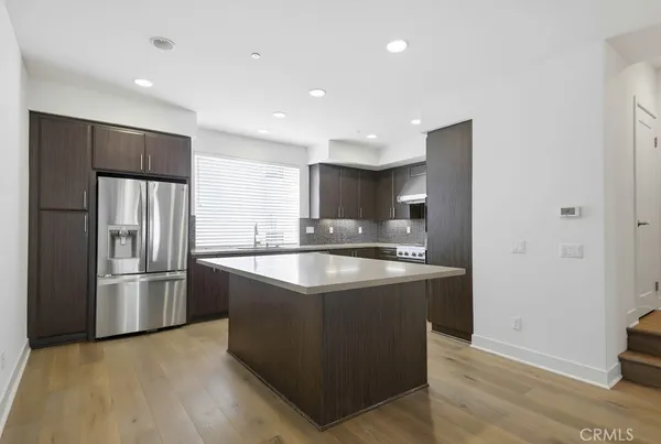 a kitchen with a stove and a microwave