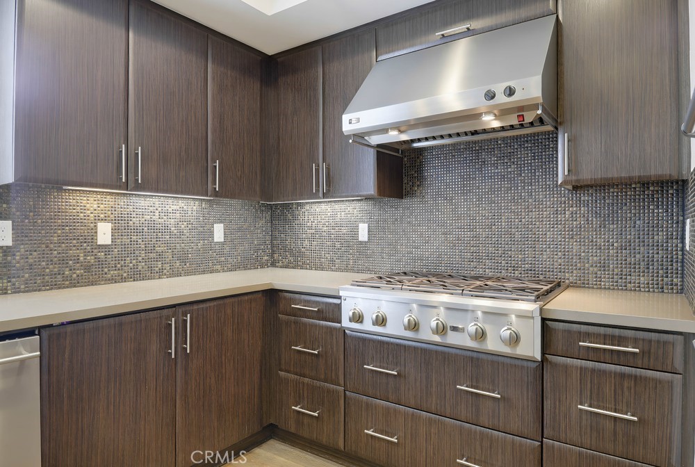 75 Lennox Irvine, CA 92612 - Photo 18 of 73 a kitchen with cabinets a sink and stainless steel appliances