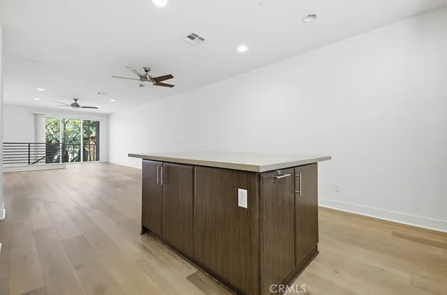 a kitchen with stainless steel appliances a sink and a refrigerator
