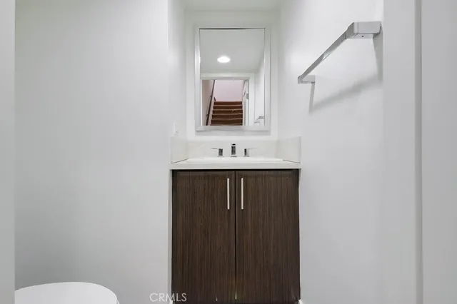 a bathroom with a double vanity sink a mirror and shower