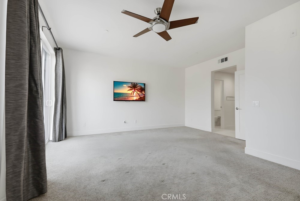 75 Lennox Irvine, CA 92612 - Photo 29 of 73 a view of an empty room and a ceiling fan