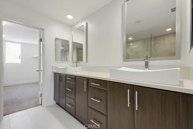 a view of a kitchen with a sink and cabinet