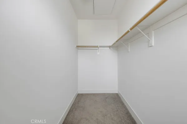 a living room with patio fireplace furniture and a potted plants