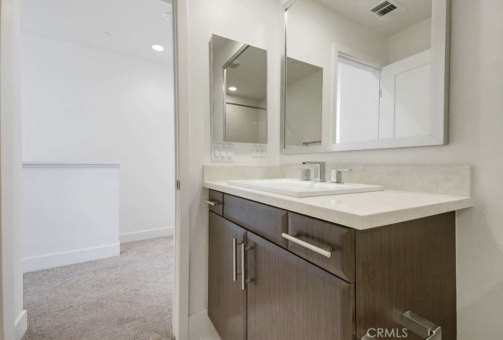 75 Lennox Irvine, CA 92612 - Photo 52 of 71 a bathroom with a sink and a mirror