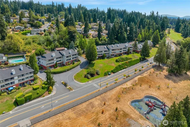 an aerial view of a house with a lake view