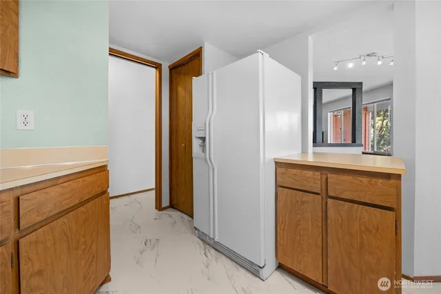 a view of hallway with washer and dryer