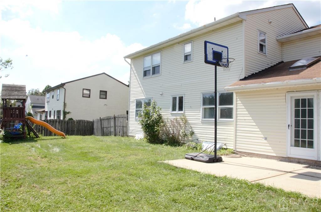 27 Sinclair Road Edison, NJ 08820 - Photo 2 of 15 a view of a house with a yard and garage