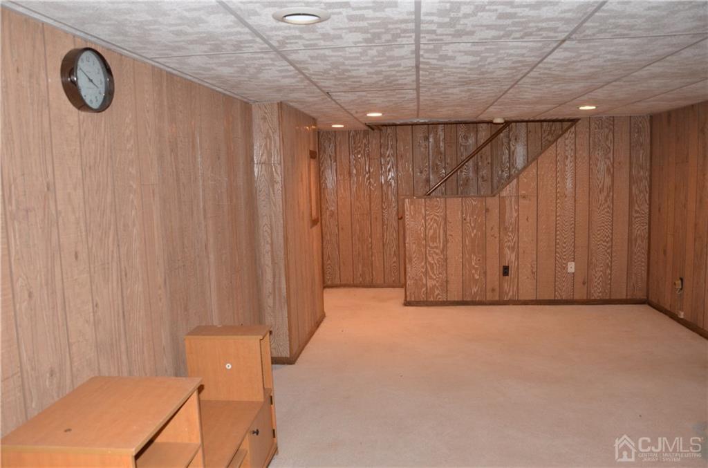 27 Sinclair Road Edison, NJ 08820 - Photo 4 of 15 a view of a room with racks on the wall