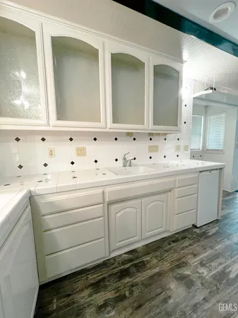 a view of a kitchen with furniture and a kitchen view