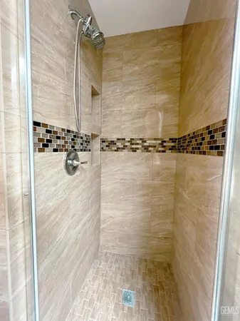a bathroom with a tub and shower