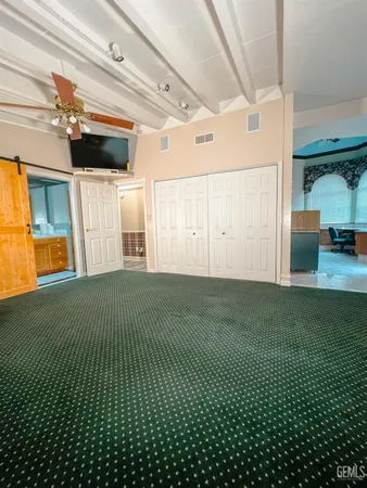 a view of living room with furniture and window